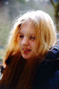 Close-up of smiling young woman with highlights