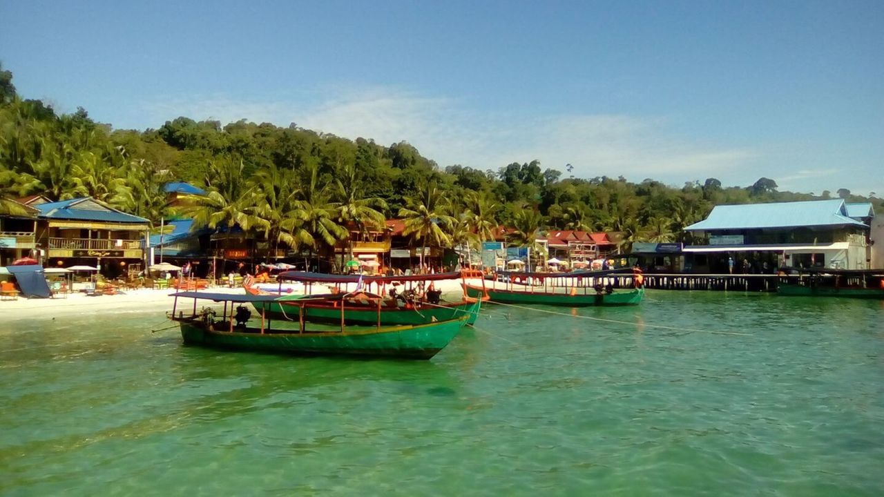 water, nautical vessel, transportation, tree, clear sky, mode of transport, sky, palm tree, architecture, outdoors, scenics, day, nature, no people, beauty in nature