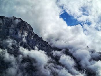 Low angle view of majestic mountains against sky