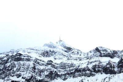 Scenic view of snowcapped mountains against clear sky