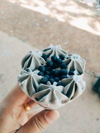 Close-up of hand holding ice cream