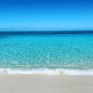 Scenic view of sea against blue sky