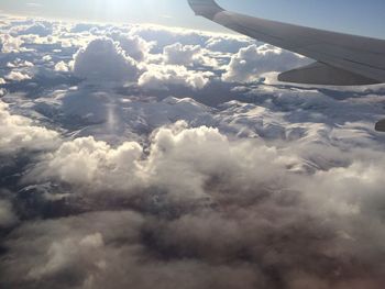 Cropped image of airplane flying over landscape