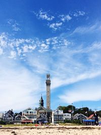 View of buildings against cloudy sky