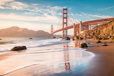 View of suspension bridge during sunset