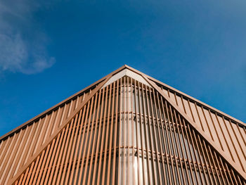 Low angle view of building against blue sky