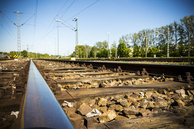 Railroad tracks against blue sky