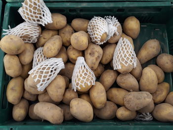 High angle view of raw potatoes for sale at market stall