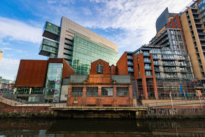 Low angle view of modern buildings against sky