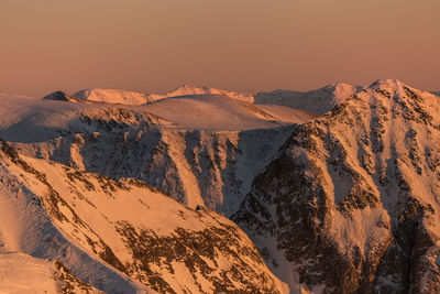 Scenic view of snowcapped mountains against sky during sunset, fagaras mountains