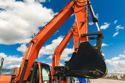 Low angle view of machinery against sky