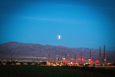 Scenic view of landscape against sky at night