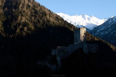 Scenic view of snowcapped mountains against clear sky