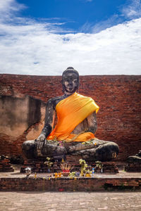 Statue of buddha against sky