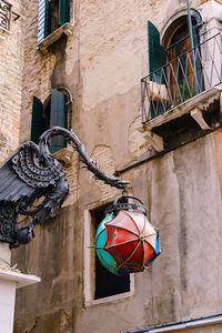 Low angle view of clothes drying against building