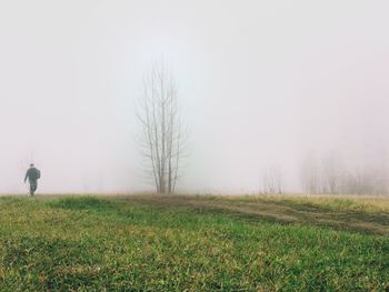 Man walking through the fog