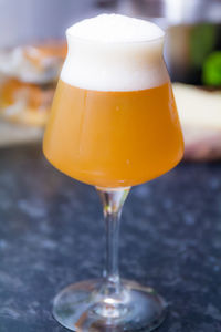 Close-up of beer glass on table