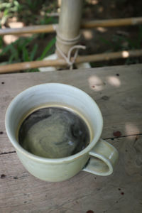 High angle view of coffee cup on table