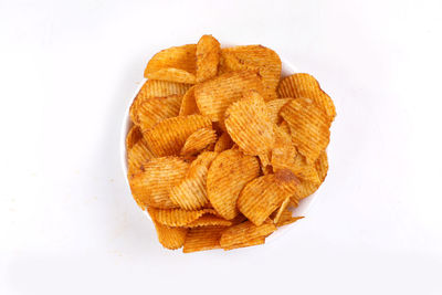 High angle view of bread in bowl against white background