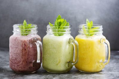 Close-up of fruits in glass jar on table