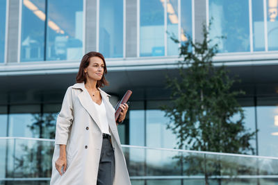 Young businesswoman using mobile phone