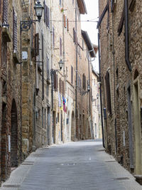 Narrow alley amidst buildings in city