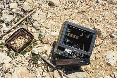 High angle view of broken electrical equipment