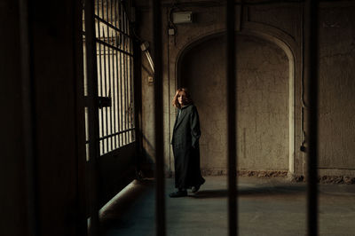 Full length of woman standing in building