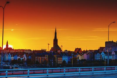 Buildings against sky at sunset