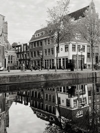 Reflection of buildings and trees in canal