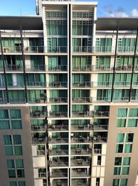 Low angle view of modern building in city against sky