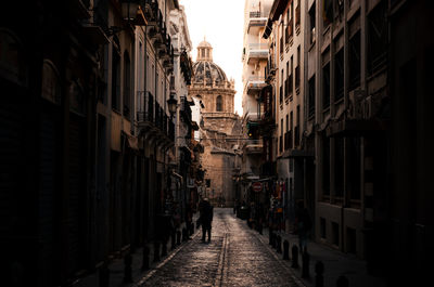 Old street along historic buildings. ideal for travel, architecture, and cityscape projects.