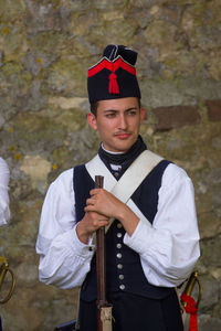 Portrait of a young man holding camera