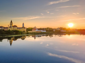 Scenic view of lake against sky during sunset