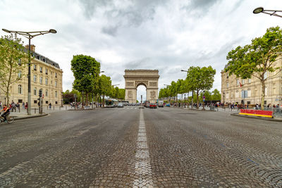 City street against cloudy sky