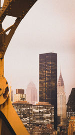 Modern buildings in city against sky