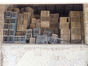 Stack of stone wall by building