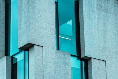 Low angle view of blue window on building