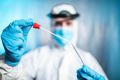 Close up of nurse with coronavirus swab. selective focus on the pad