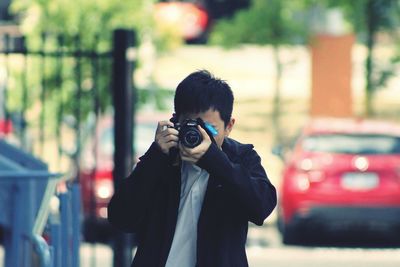 Portrait of man photographing