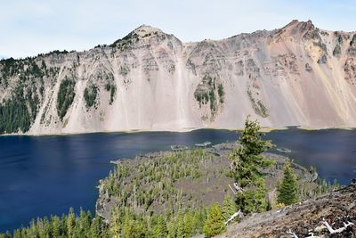 Scenic view of waterfall against sky