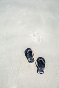 High angle view of shoes on sand