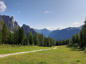 Scenic view of landscape and mountains against sky