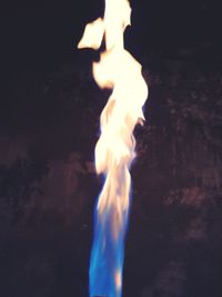 Close-up of fire burning at night