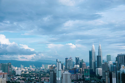 Modern buildings in city against sky