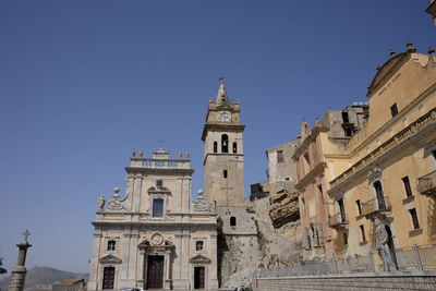 Low angle view of old church at caccamo against clear sky