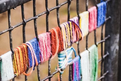 Close-up of multi colored hanging on clothesline