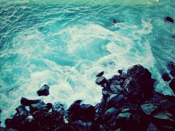 Waves splashing on rocks