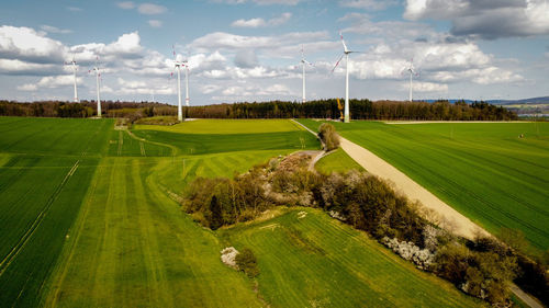 Scenic view of golf course against sky