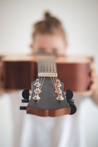 Close-up of playing guitar